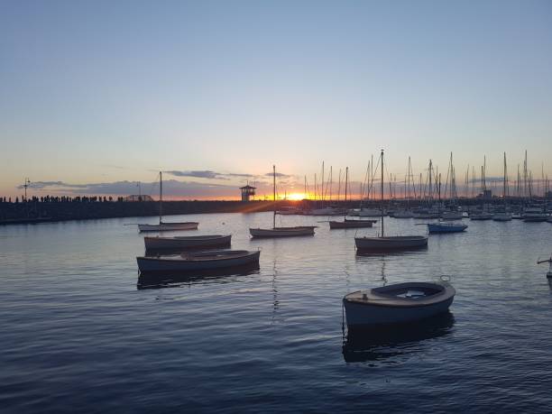 istock Boats in the sea at sunset 1460187629