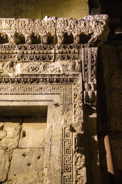 istock Beautiful Archaeological inscriptions on a historical wall at night 1460188914