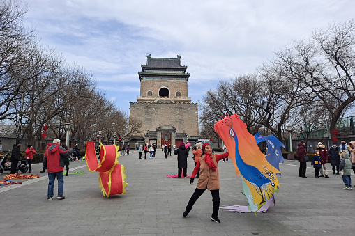 Beijing, China - April 8th, 2015: Locals practice Tai Chi in one of the parks surrounding the Forbidden City.