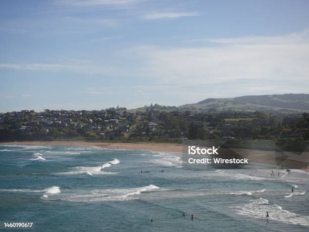 People Resting On The Sandy Beach And Swimming In The Blue Ocean In Kiama Town On A Sunny Day Stock Photo - Download Image Now
