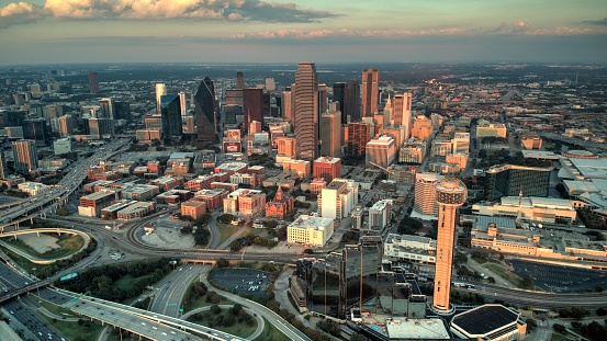 An aerial shot of the skyline of downtown Dallas, Texas during a sunset