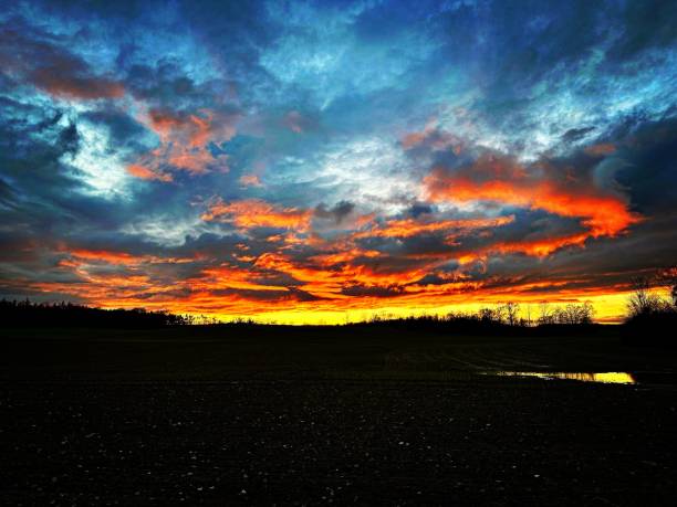 istock Scenic sunset cloudscape over a countryside landscape 1460191703