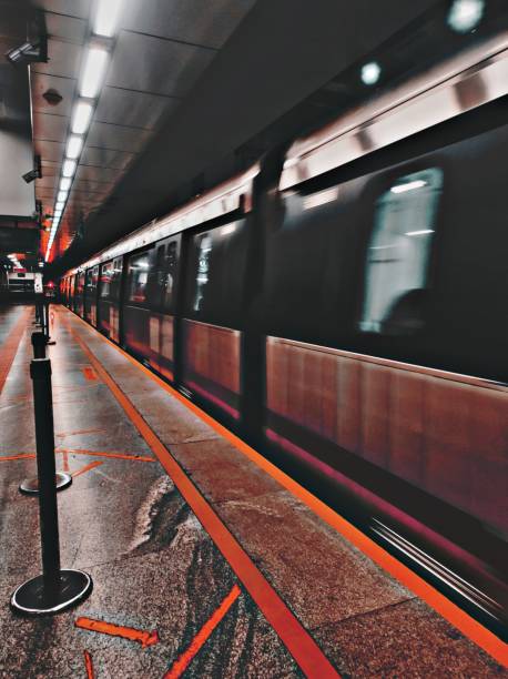 istock Blur shot of a train moving past a platform on a station 1460191954