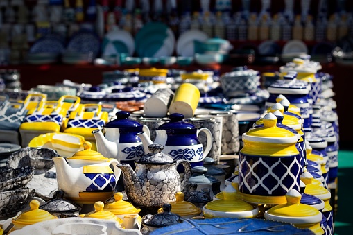 A closeup shot of Asian handmade ceramic, potteries, jars, vessels, cups, and mugs
