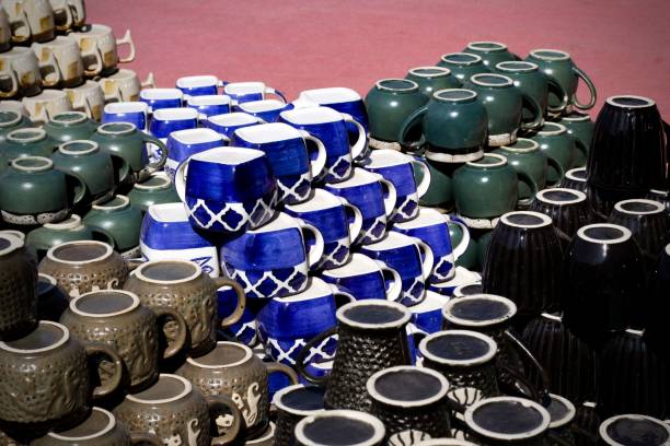 Closeup shot of colorful ceramic cups with Asian cultural patterns on them