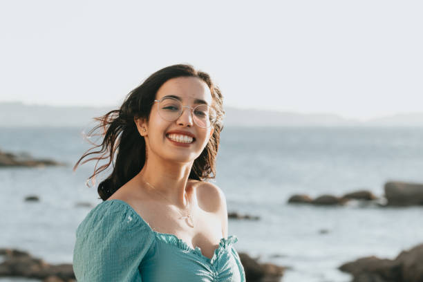 istock Happy Middle Eastern female with a beautiful smile posing on the beach 1460195177