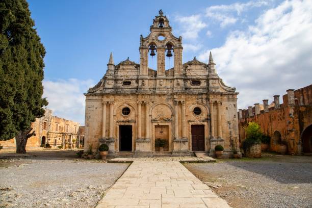 istock Old cathedral church with a tree on the side under a blue cloudy sky 1460196153