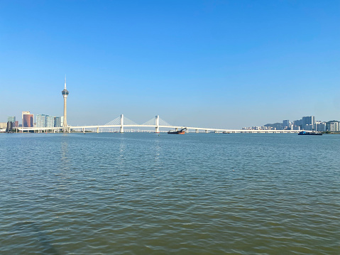 December 24, 2022- Macau, China: Here is the Macau Tourism Tower and Xiwan Brdge seen from Zhuhai side.