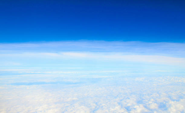 istock blue sky and clouds seen from the plane 1460196963