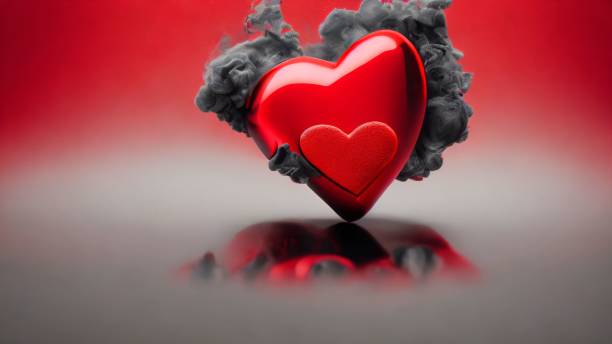istock 3D render illustration of a bright shiny red heart shape in grey smoke texture on a silver surface 1460197019
