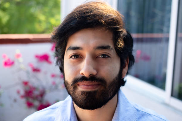 istock Shallow focus shot of a cheerful young Hispanic good-looking guy with a beard 1460198255