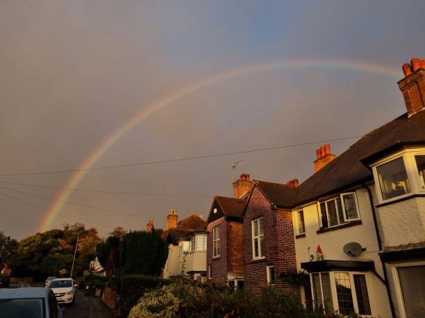 istock Beautiful rainbow over the houses 1460198337