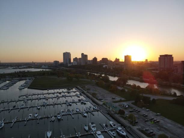 istock Drone over harbor with cityscape at seaside in Wisconsin at sunset 1460198374