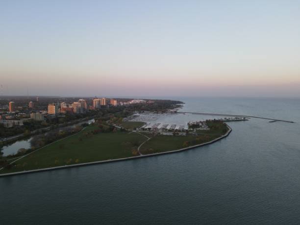 istock Drone over harbor with cityscape at seaside in Wisconsin at sunset 1460198376