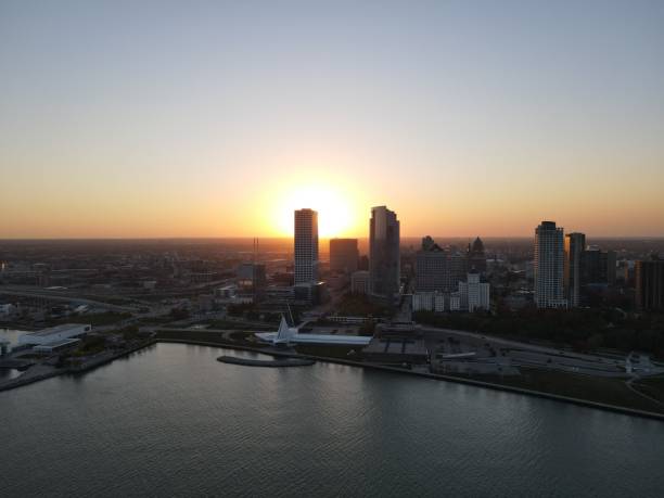 istock Drone over harbor with cityscape at seaside in Wisconsin at sunset 1460198381