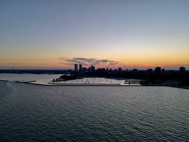 istock Drone over harbor with cityscape at seaside in Wisconsin at sunset 1460198389