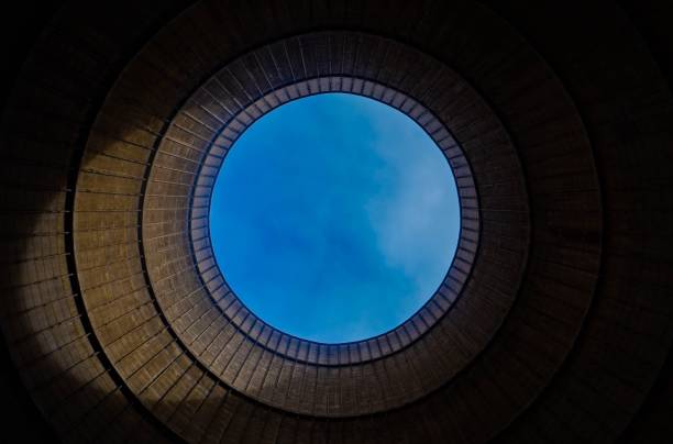 istock Round frame of a cooling tower with the blue sky in the background. 1460198697