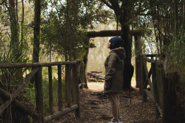 istock Young Hispanic woman walking through nature, enjoying the scenery 1460200926