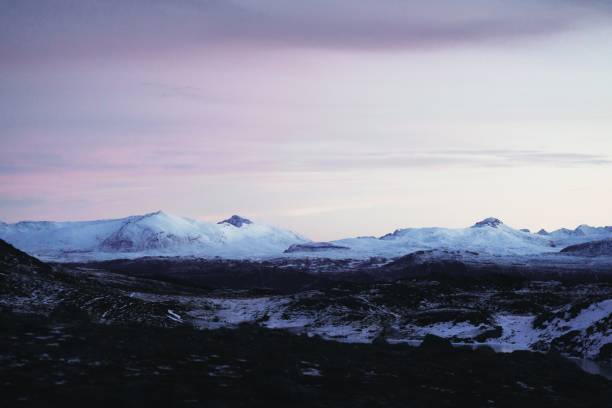 istock Rocky mountains covered with snow in the evening, Tromso, Norway 1460201224