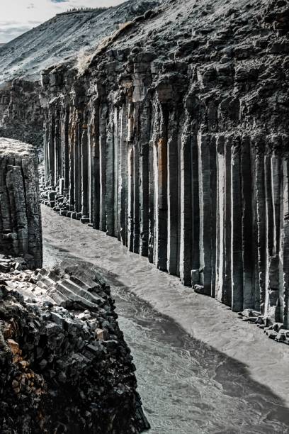 istock Vertical shot of a river flowing through rocky cliffs 1460202405