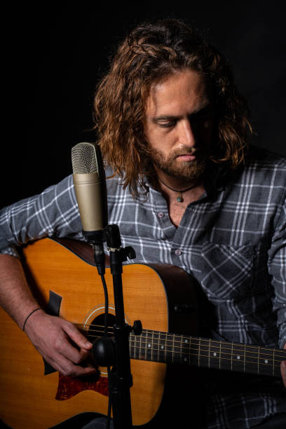 istock Caucasian musician playing guitar in Spain 1460203345