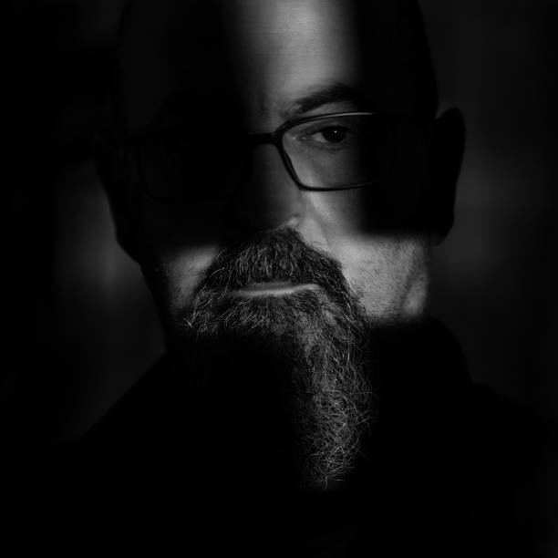 istock Man in the dark room 1460204057