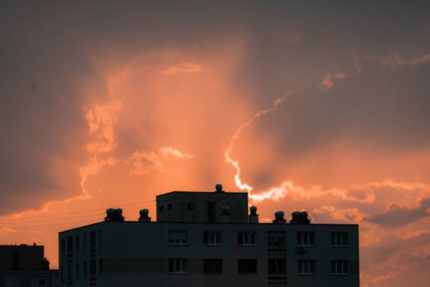 istock Sky above a city building glowing red during sunset 1460205251