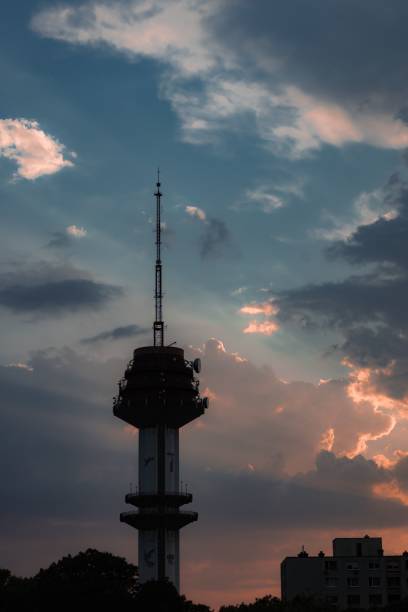 istock Vertical of a tower with communication antennas against the blue sky 1460205253