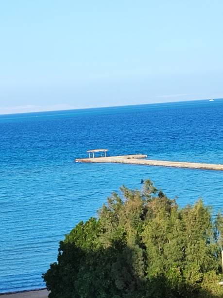 istock View of a blue sea on a sunny day 1460209082