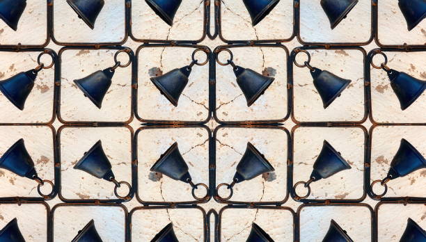 istock Symmetric Black Rustic Bells. Abstract Iron Decorative Hanging Bells. Home design 1460210855