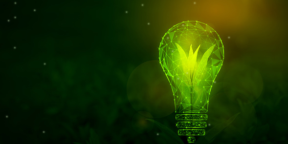 Abstract green energy concept with glowing low polygonal lightbulb and green sprout on dark green background. Carbon neutrality, renewable energy sources, ecology, safe electricity concept. Copy space