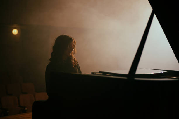 istock Woman playing the piano 1460217060