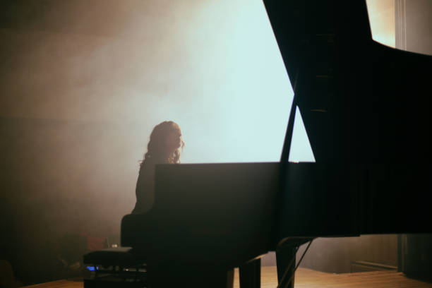 istock Woman playing the piano 1460217061