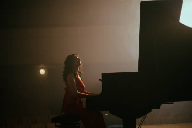 istock Woman playing the piano 1460217118