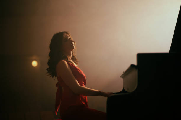istock Woman playing the piano 1460217170