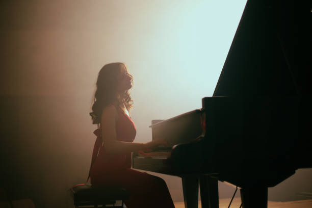 istock Woman playing the piano 1460217177