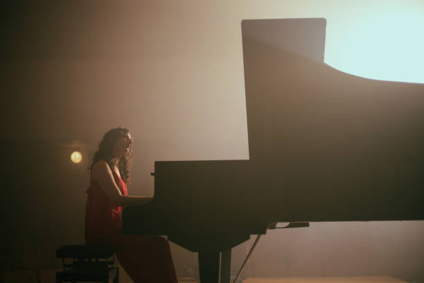 istock Woman playing the piano 1460217371