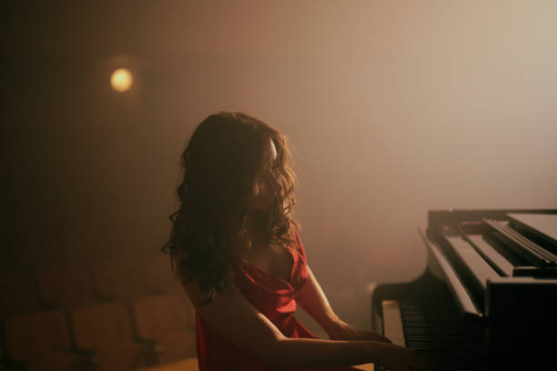 istock Woman playing the piano 1460217397