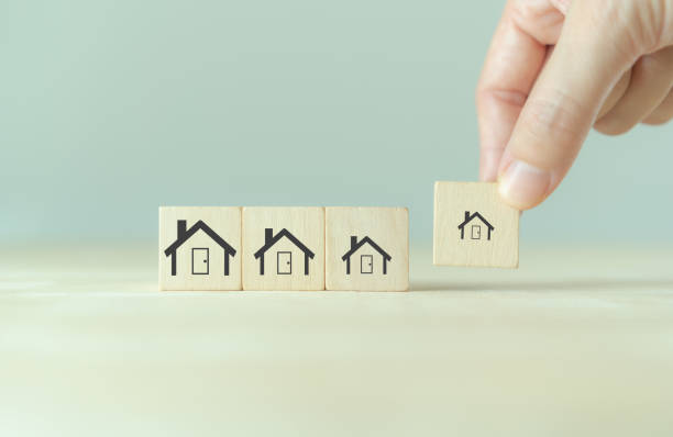 istock Downsizing home, houses concept. Downsizing property due to retirement or budget. Finding a tiny house or apartment. Moving to a smaller property for retirement time.  Increasing cash flow. 1460217470