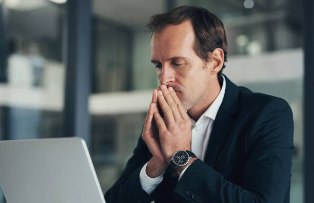 istock Thinking, idea and business man with laptop in office working on strategy, planning and problem solving. Corporate manager, inspiration and male with focus for solution, decision and project deadline 1460220614