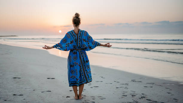 istock Young woman enjoying time at sea, meditating. 1460221276