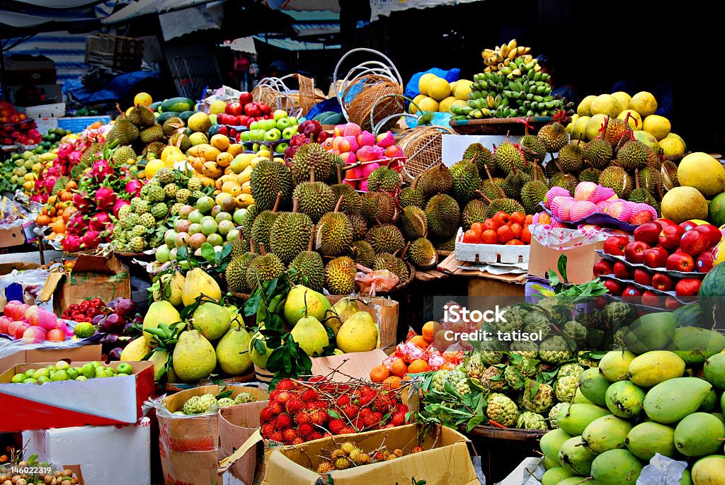 Table and boxes filled with a variety of exotic fruits exotic fruits, asian market  Fruit Stock Photo