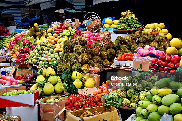 Table And Boxes Filled With A Variety Of Exotic Fruits Stock Photo - Download Image Now