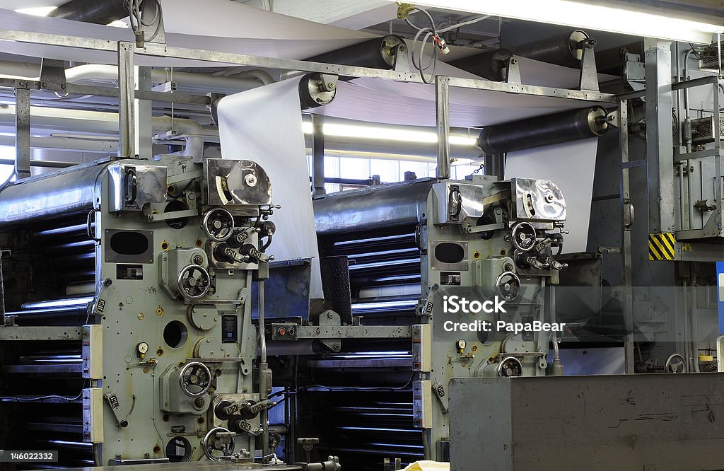 Press ink rollers Ink rollers and paper on a four-color web printing press Rotary Press Stock Photo