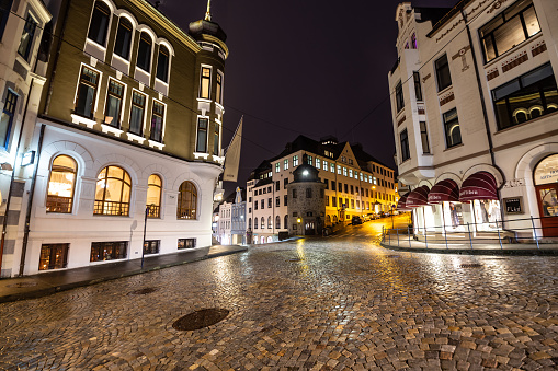 Famous street in old tow of Alesund at night after rain Norway Scandinavia Europe