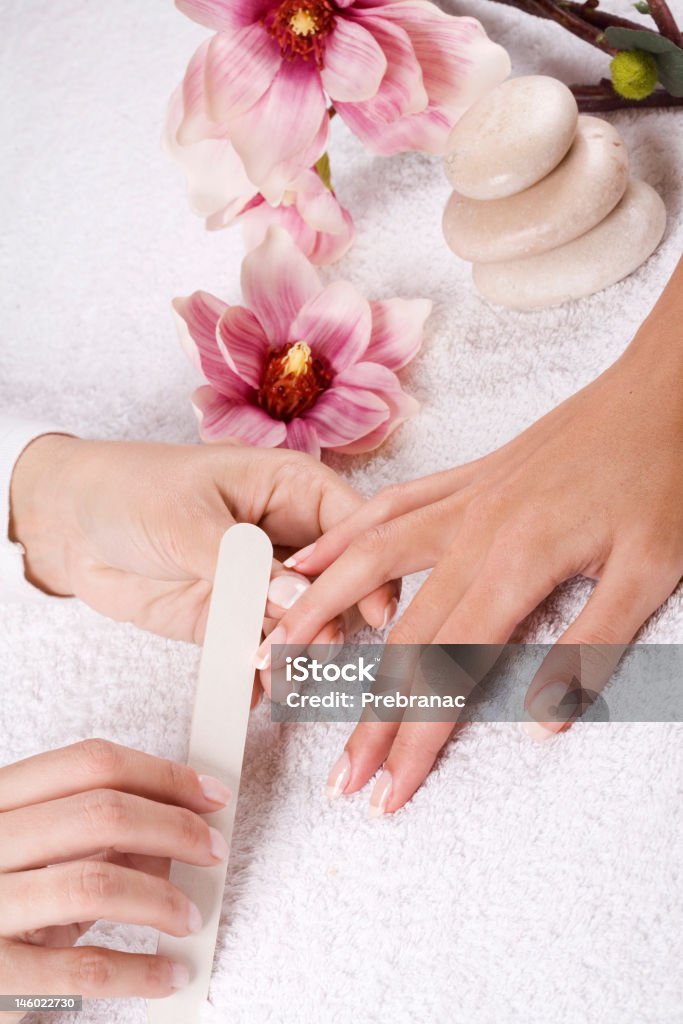 A woman receiving a nice manicure manicure treatment at the wellness center Aesthetician Stock Photo