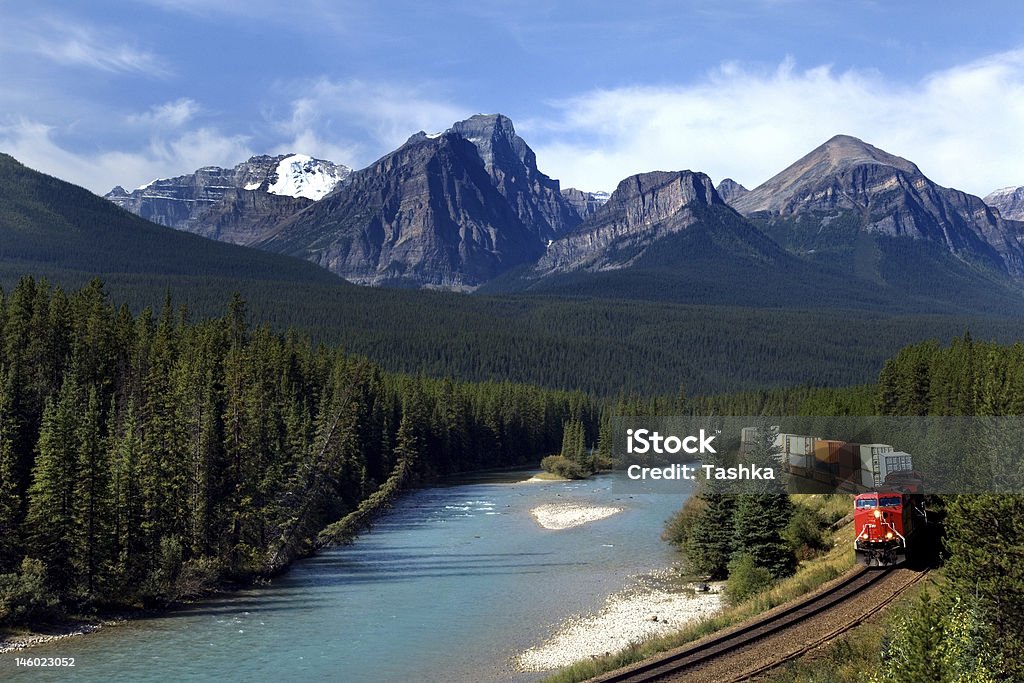 Canadian Pacific railway Freight train moving along Bow river in Canadian Rockies Freight Train Stock Photo