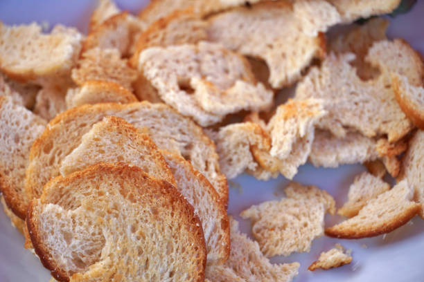close up of a bread pieces on white background.