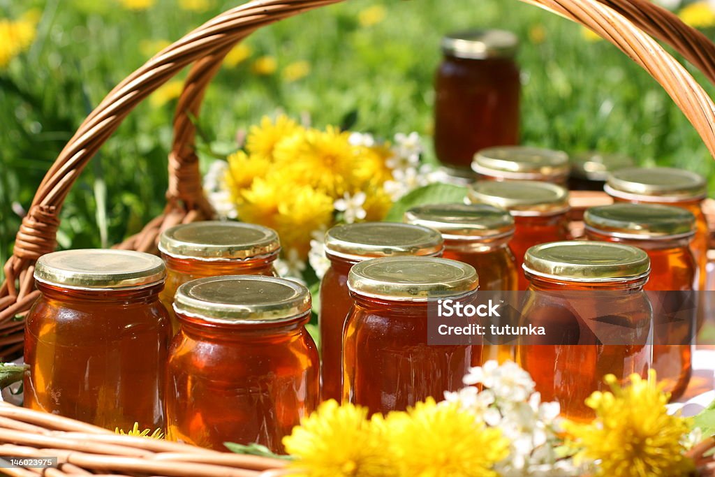 honey in glass Damdelion honey in glass Bee Stock Photo