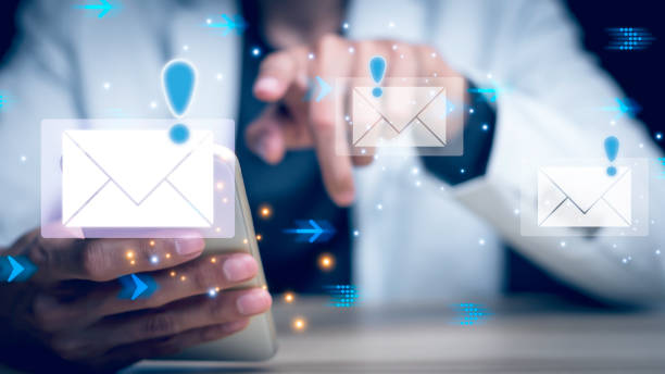 istock Businessman touching smartphone with open e-mail, receiving business e-mail news alerts Advertising by sending and customer messaging. online digital technology direct selling business, reminder. 1460240520